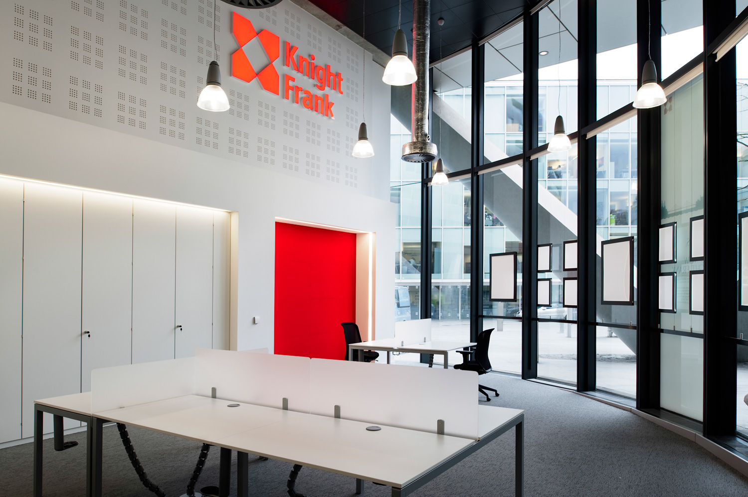 Sales and letting agencies design - double height office space with exposed duct and pendant lighting