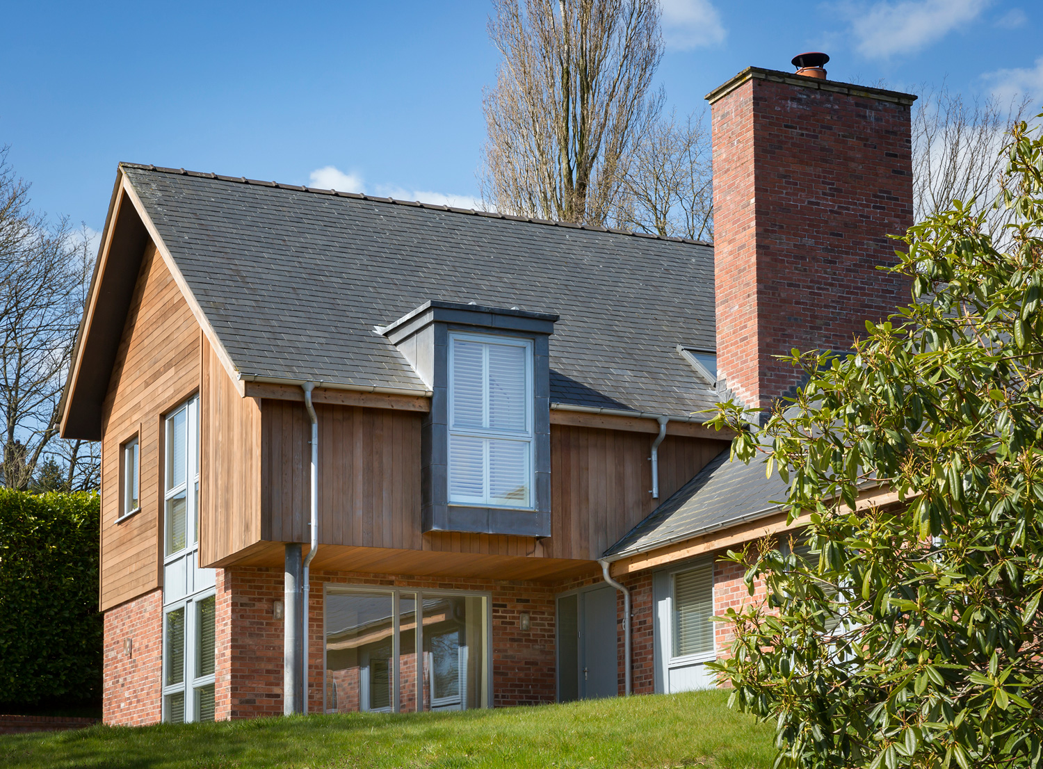 Contemporary residential property - front daytime view showing cedar and zinc cladding