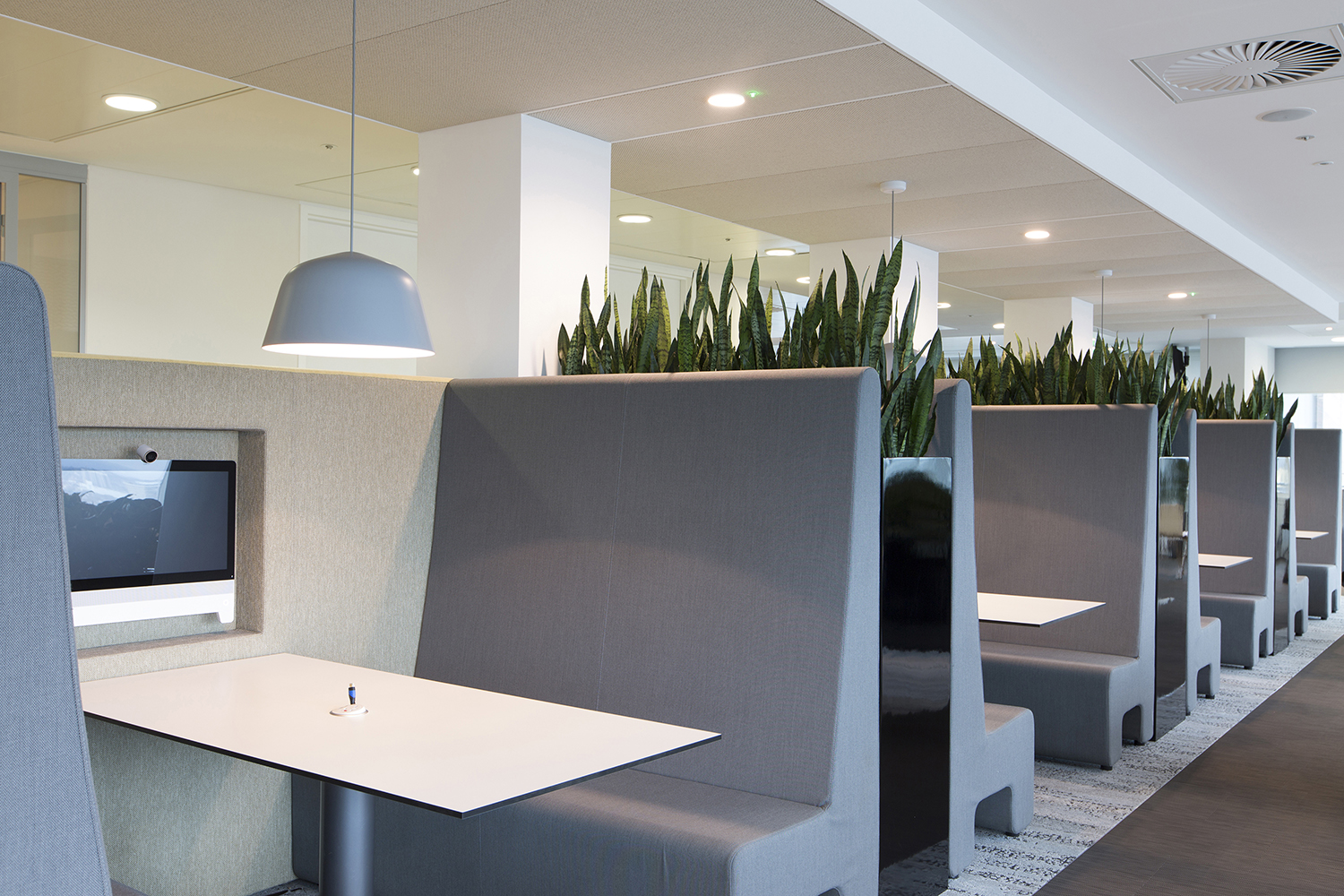 London headquarters interior architecture redesign - booth seating in the coffee bar providing informal meeting areas