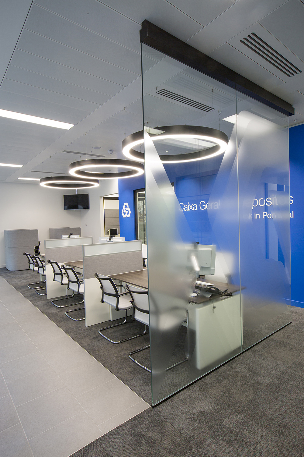 Design and branding for Caixa customer suite in London - customer service area with feature lighting