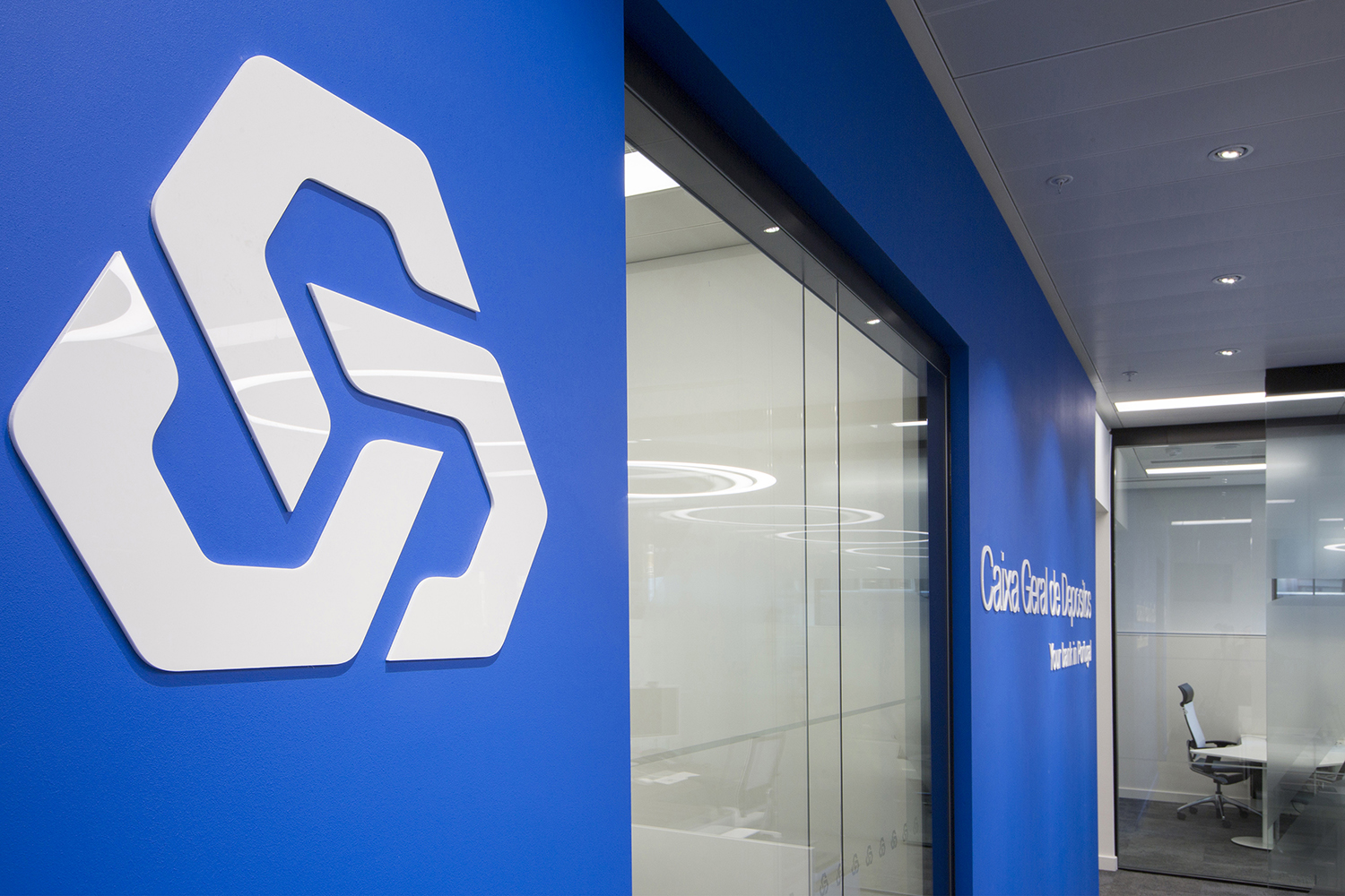 Design and branding for Caixa customer suite in London - close up photo of branded wall