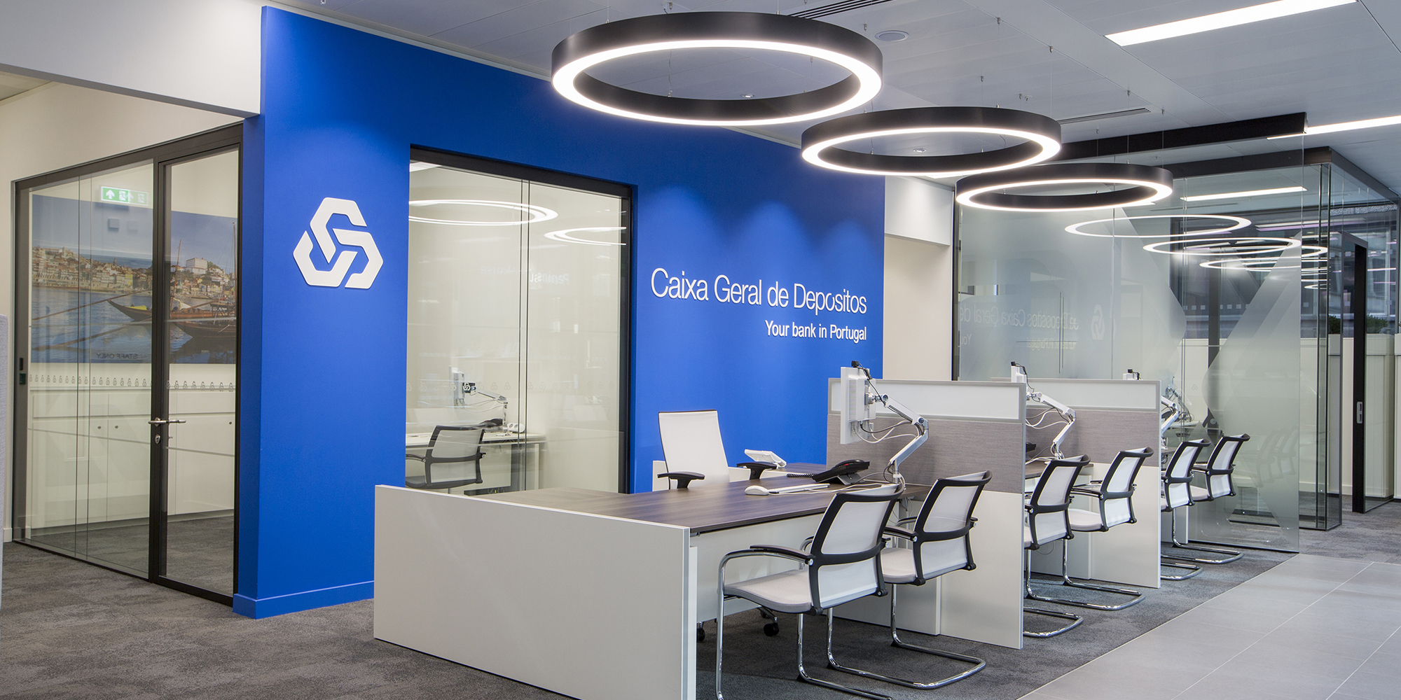 Design and branding for Caixa customer suite in London - customer service area with feature lighting