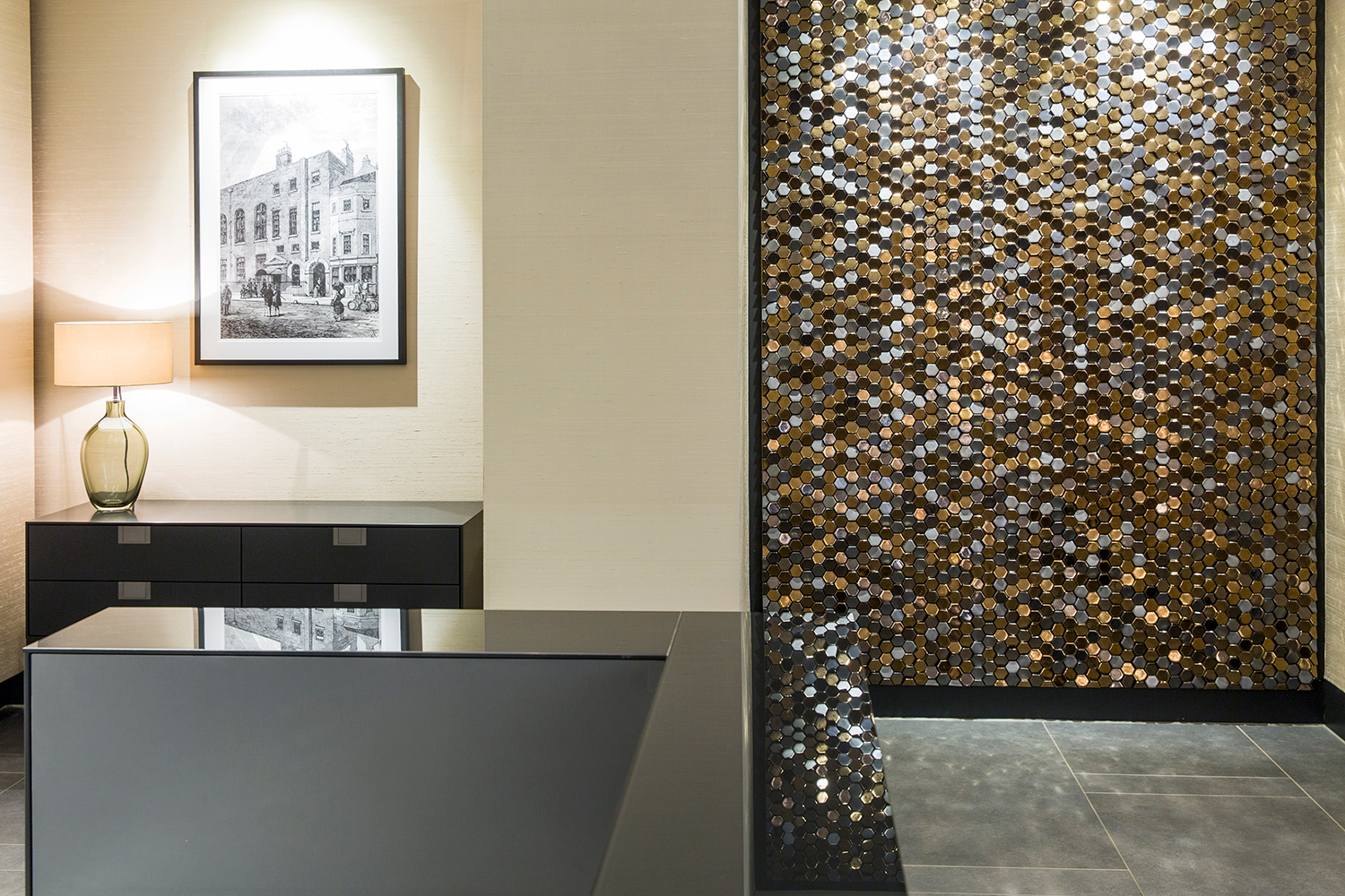 Plush Mayfair reception and waiting area design - Giles Miller mosaic artwork reflected in reception desk