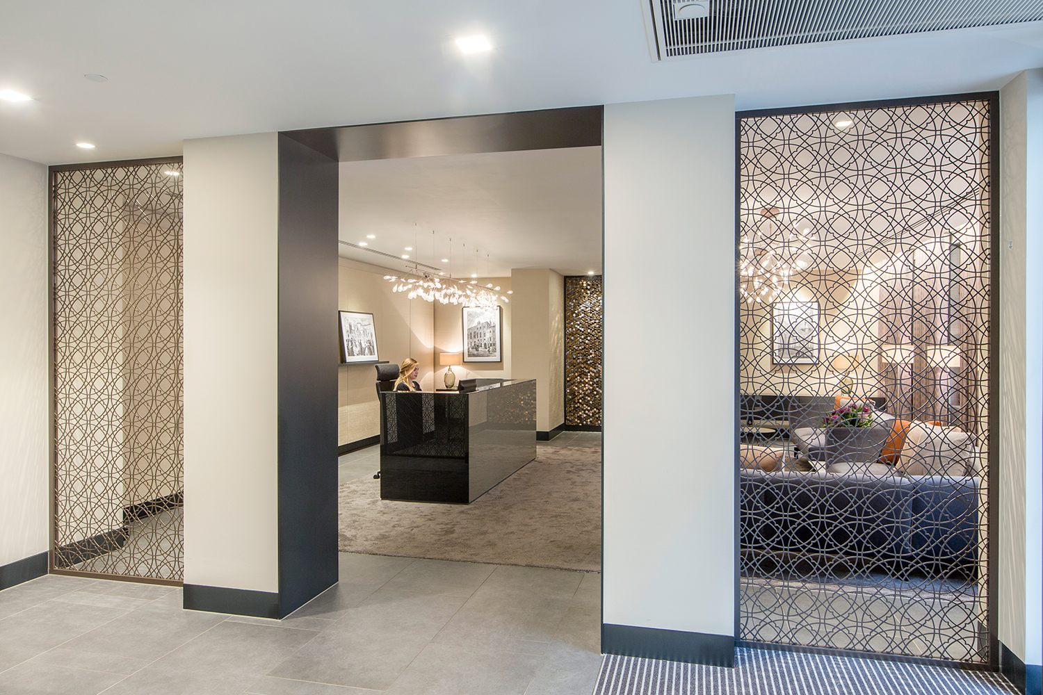 Plush Mayfair reception and waiting area design - view from entrance through to reception
