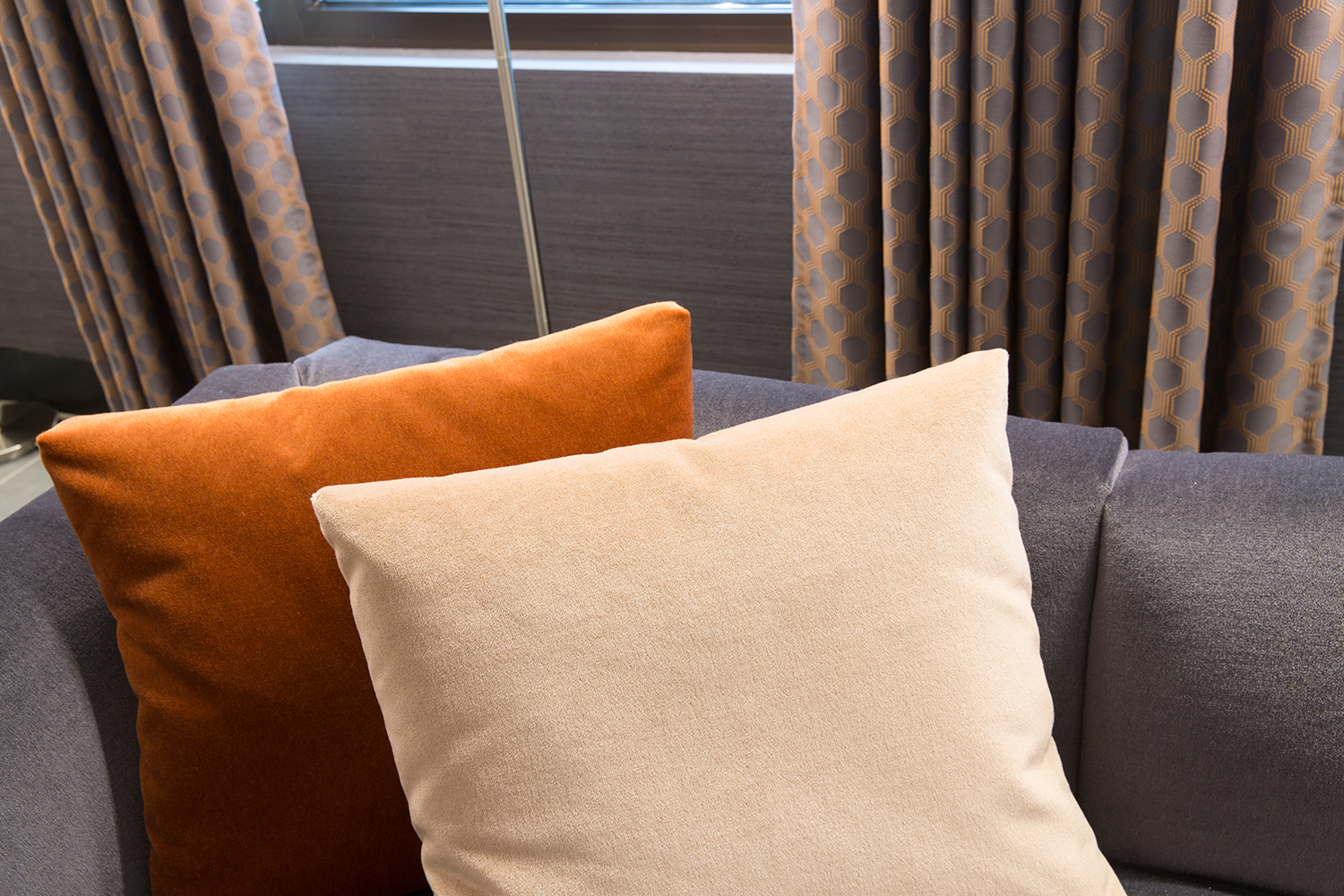 Plush Mayfair reception and waiting area design - feature velvet sofas and cushions