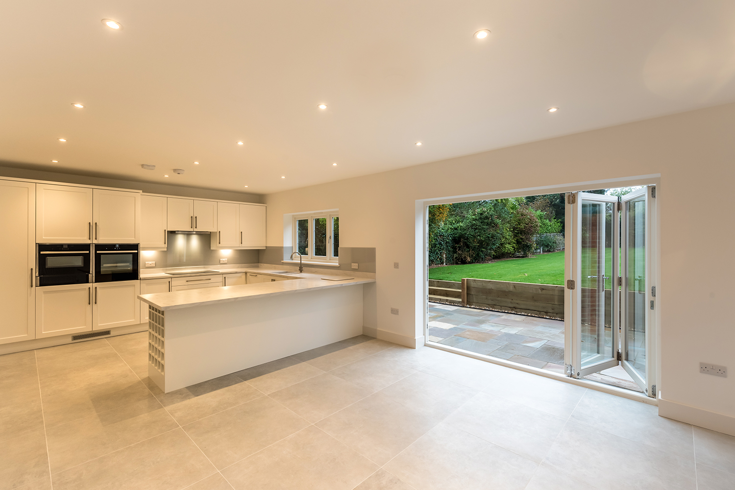 Large open plan kitchen with bi-folding doors