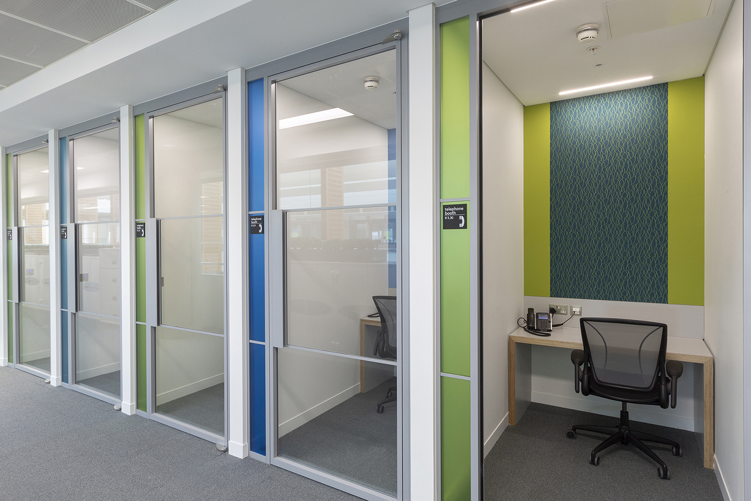 Phone booths within this office and laboratory design